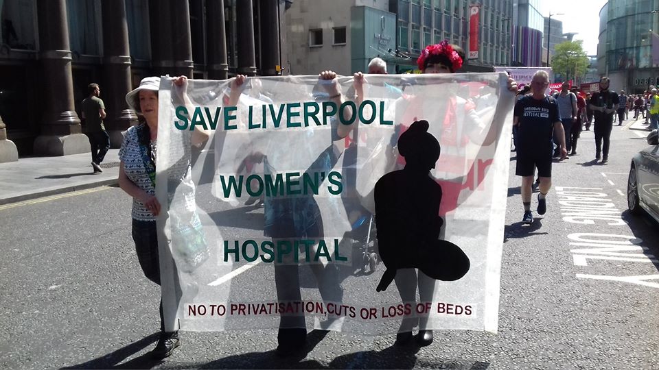 helen and pam carrrying the banner